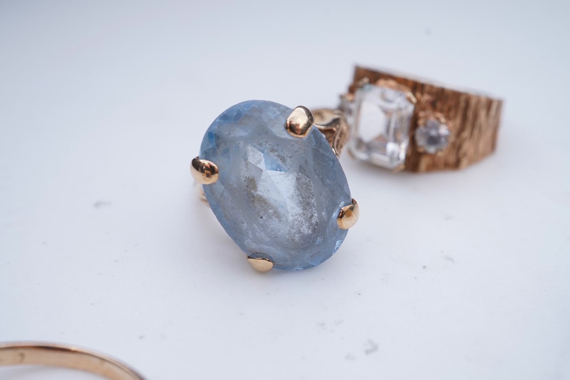 Four gem-set rings